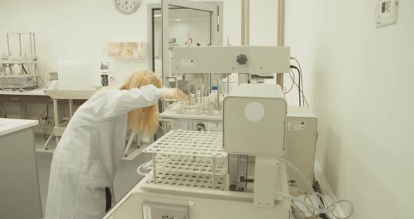 Scientist working in a pharmaceutical laboratory conducting experiments