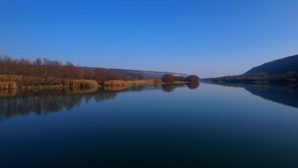 the Drone Flies Over a River Beautiful Reflections in the Water on Morning