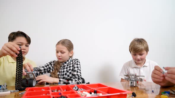 Young Friends Having Fun Using Building Kit