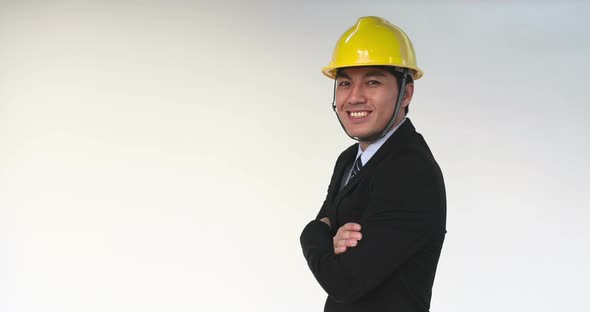 Young Asian Engineer in Construction Helmet