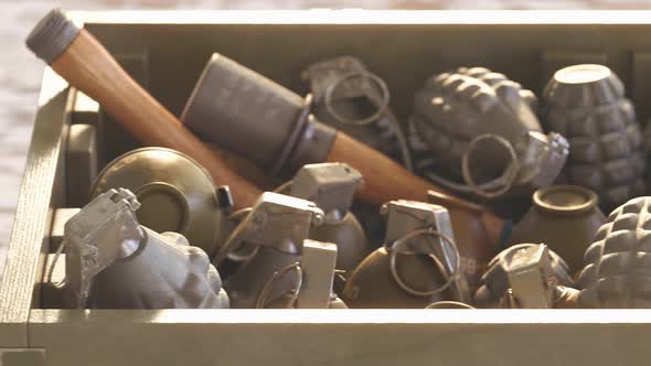 Close up of piled up different types of grenades in wooden ammunition box. 4k HD