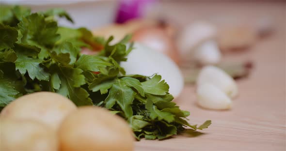 Fresh Food Ingredients On Wooden Table In Kitchen