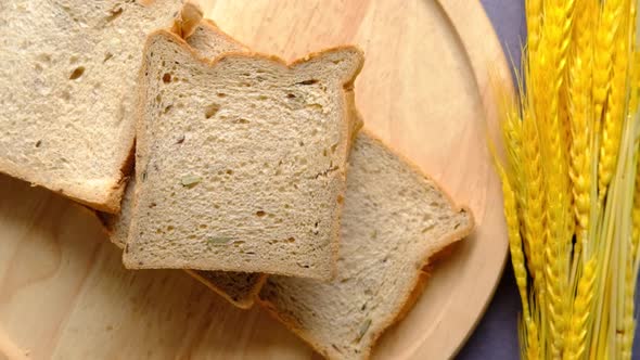 Slow Motion of Brown Bread Dropping on Table