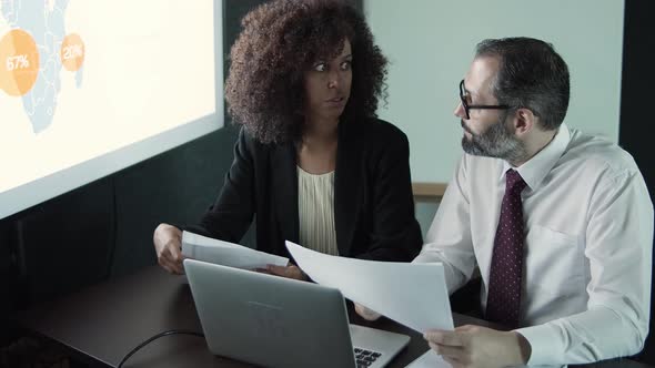 Bearded Boss Talking with Young African American Assistant