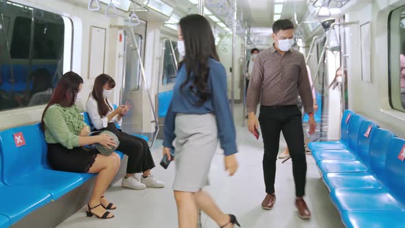Crowd of People Wearing Face Mask on a Crowded Public Subway Train Travel