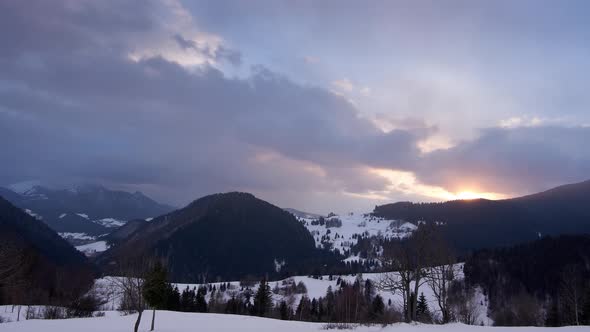 Sunset in winter ,Clouds move in the sky, zoom in