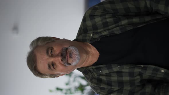 Happy Old Man with Grey Hair in Casual Clothes Looking to the Camera