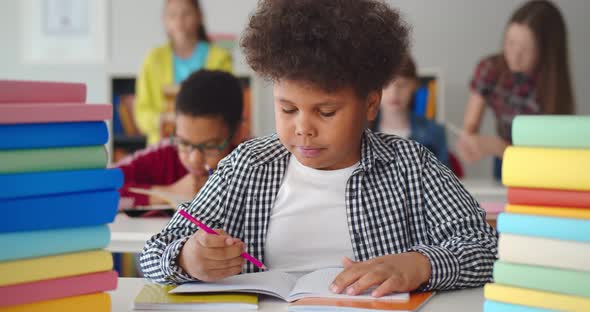 African Kid Enjoying Learning to Draw at Middle School