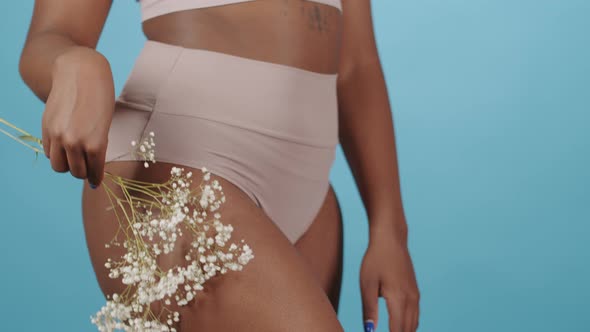 Plus Size Woman in Underwear with Babys Breath Flowers