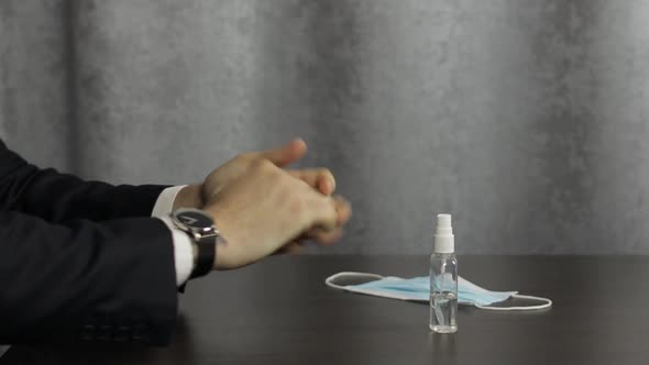 Man Using Bottle of Liquid Alcohol Spray Sanitizer with Hands. Coronavirus