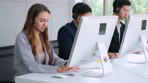 Business People Wearing Headset Working in Office