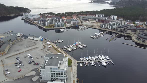 Aerial looking down at piren and sjosanden at Marna river mouth in Mandal - Calm evening aerial Norw