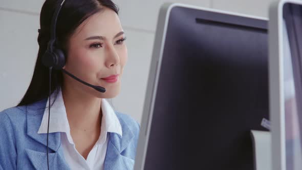 Customer Support Agent or Call Center with Headset Talking to Customer on Phone