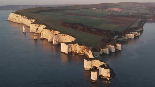 Old Harry Rocks cliffs in Dorset coast, England. Aerial flyback