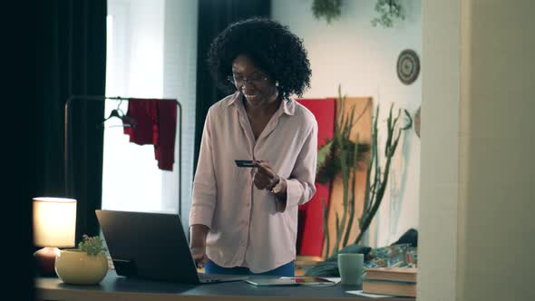 Brown-skinned Lady Is Shopping Online From Home. Online Shopping Concept.