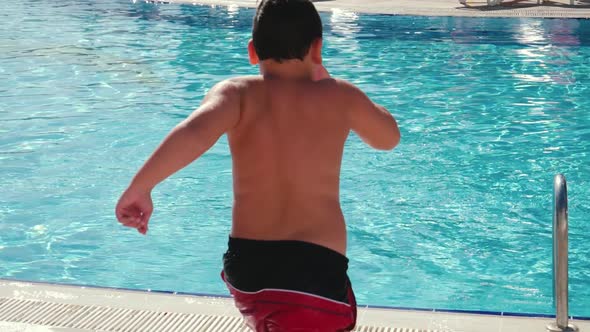 Kid Jumping in Pool