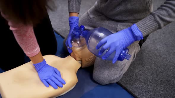 Saving patient's life on a dummy. 