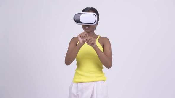 Young African Woman Using Virtual Reality Headset