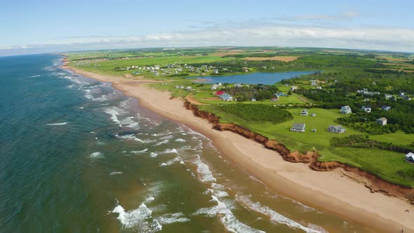 Aerial view of Thunder Cove, Prince Edward Island on a beautiful sunny day. Landscape is distant, lu