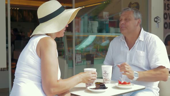 Couple Drinking Coffee and Taking Selfie on Smartphone