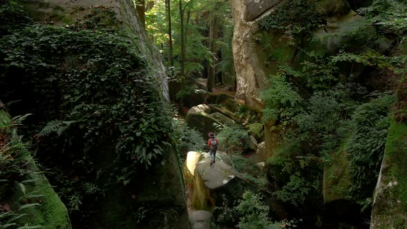 Woman Hiker with Backpack at Dovbush Rocks Canyon