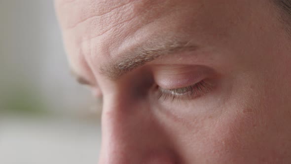 Handsome Man Looking Into Distance Close Up Face Part and Eye View