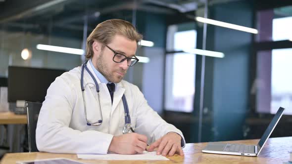 Doctor Writing Documents, Working on Medical Report