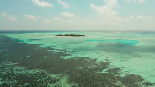 Tropical Island with Beach and Atoll with Coral