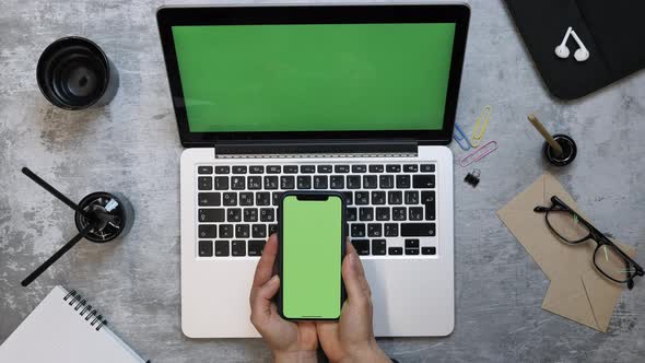 Phone and laptop computer with green screen