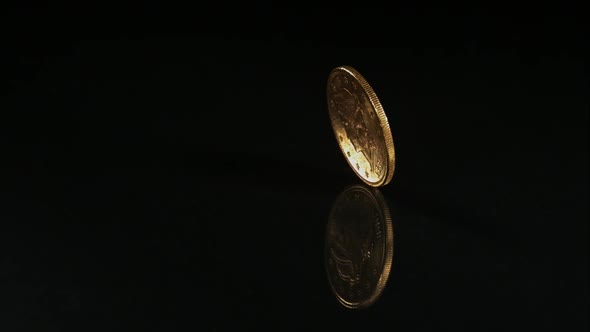 Golden coin spinning in ultra slow motion