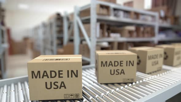 Boxes with MADE IN USA Text on Warehouse Conveyor