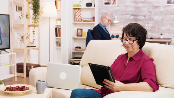 Zoom in Shot of Elderly Age Woman Using Tablet