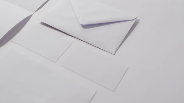 Video of envelope and white cards with copy space on white background