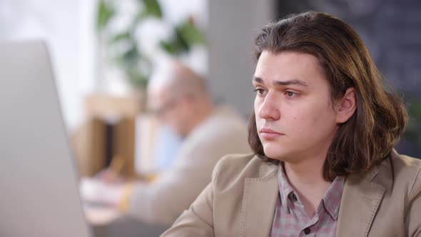 Man in Jacket Working in Office