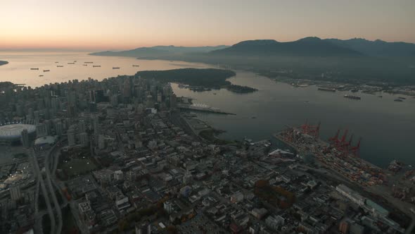 Aerial wide shot of Vancouver Eastside and docks, Countinue, Dusk