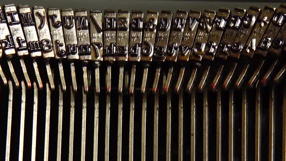 Mechanism of a retro typewriter. Old typewriter hammers. Close up.