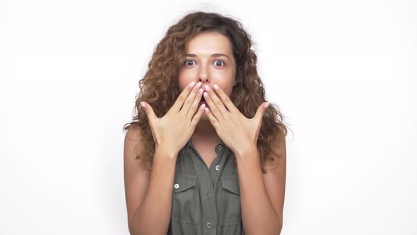 Young Pretty Lady in Grey Shirt Expressing Excitement and Happiness Like Winning in Lottery Closeup