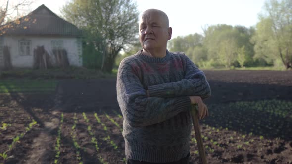 Portrait of a Elderly Farmer After Working in the Field