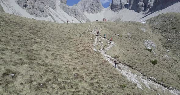 Aerial drone view of hikers hiking in the mountains