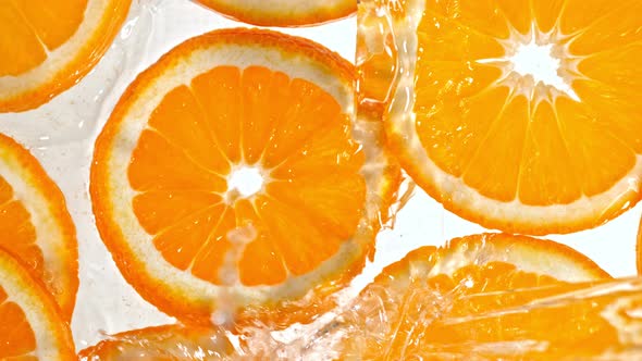 Super Slow Motion Shot of Splashing Orange Slice at 1000Fps