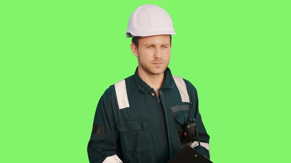 Seaman or Marine Deck Officer Standing with Clipboard and Vhf Radio