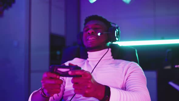 Portrait Shot of Disappointed Young Black Man Professional Game Player Losing in Video Game