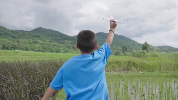 Boy Running With A Airplane