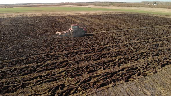 Farmer on a Tractor Prepares the Land Using a Seeder-cultivator, Agribusiness