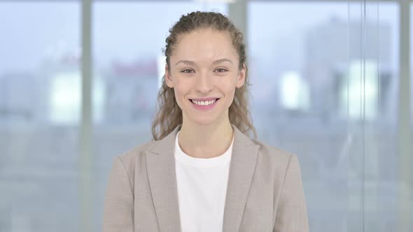 Portrait of Smiling Young Businesswoman Looking at the Camera