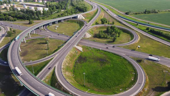 Aerial view of road interchange or highway intersection with busy urban traffic