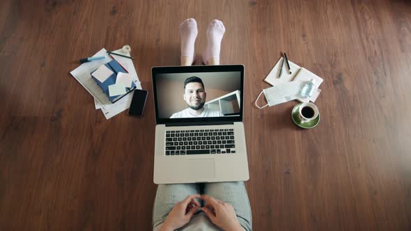 Young Woman Smiling While Videoconferencing at Home During Coronavirus Self Quarantine