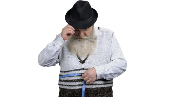 Bearded Man Measuring His Belly with Tape Measure