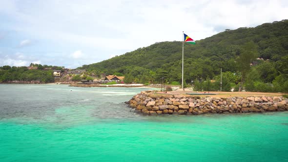 The Flag of Seychelles in the Port of La Digue Island