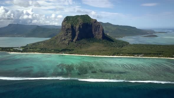 drone shot panning right above the Morne brabant mountain in Mauritius island